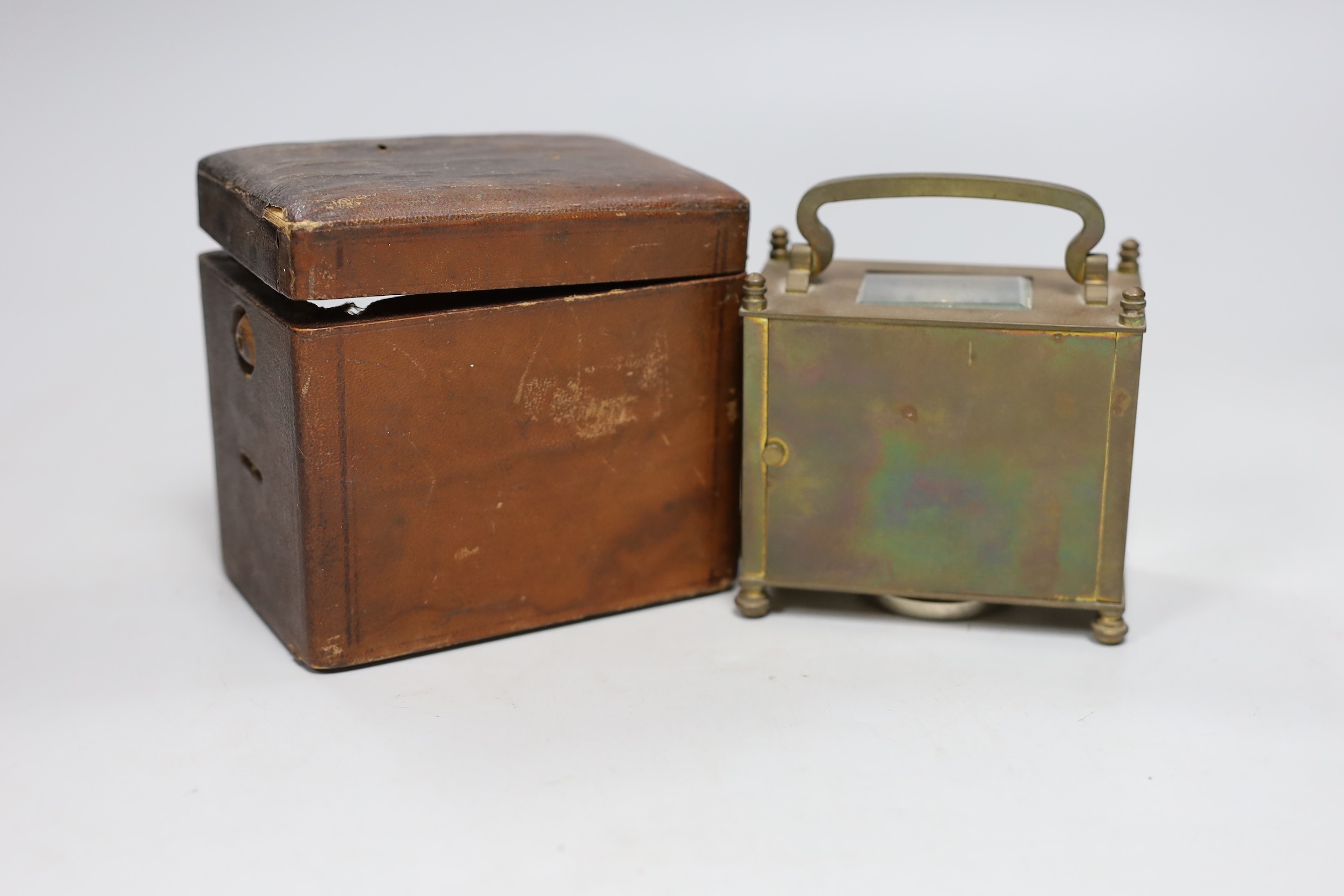 A lacquered brass carriage clock, 12cm wide, cased